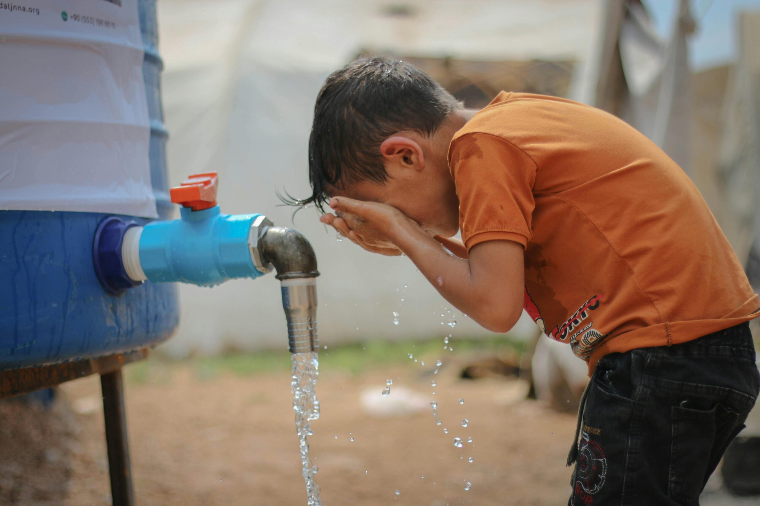 Child drinking water amidst heatwave